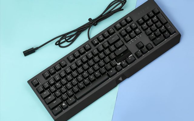 a black keyboard with a cord